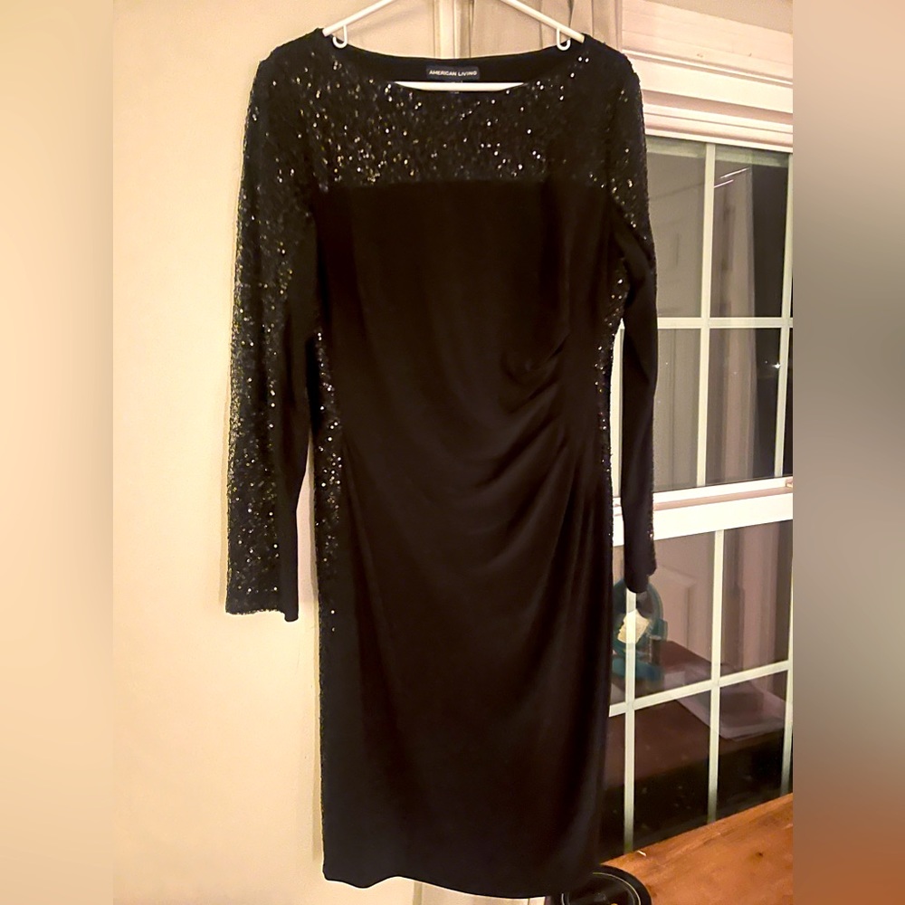 Black cocktail dress with sequenced arms